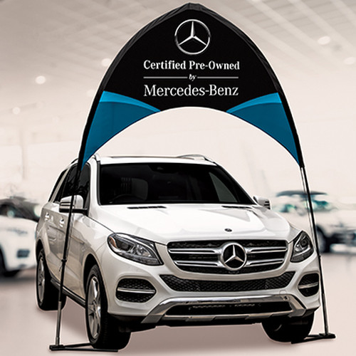 Custom arch banner displayed over a Mercedes-Benz vehicle