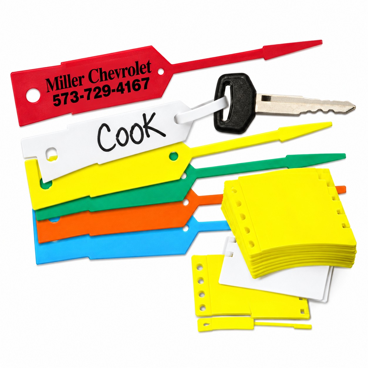 Assorted colored arrow key tags with self-locking tails, a car key and a stack of yellow tags