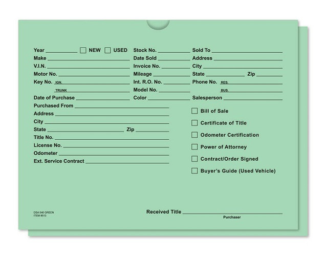 Green dealer record envelope with printed vehicle information fields