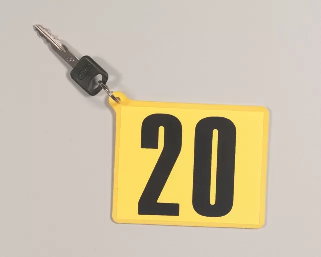 Yellow plastic key paddle with black number 20 decal, metal key ring and example vehicle key