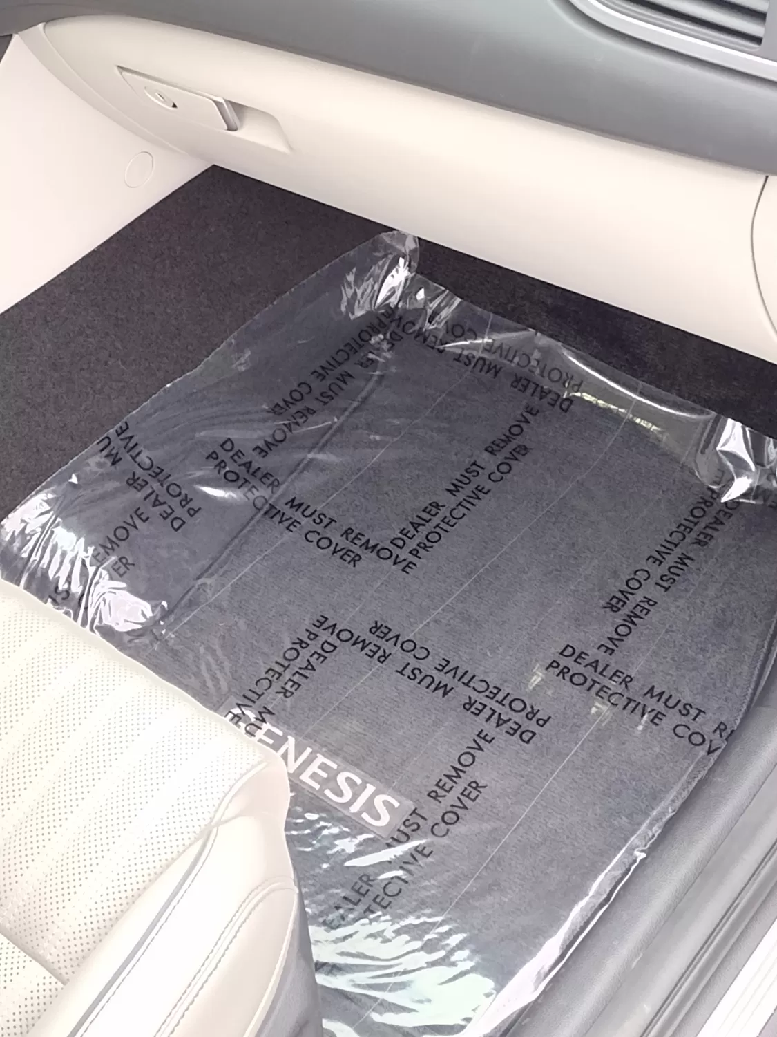Clear 3 mil adhesive floor mat protecting vehicle carpet, printed Dealer Must Remove Protective Cover