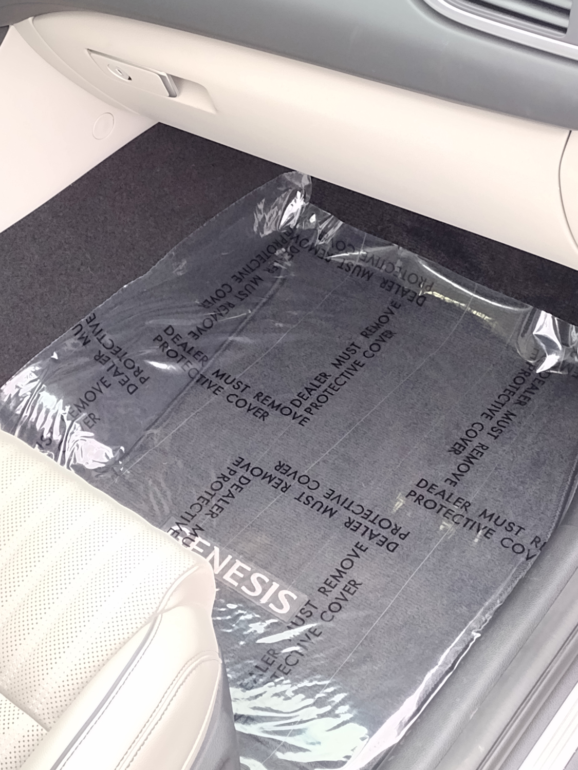 Clear 4 mil adhesive floor mat protecting vehicle carpet, printed Dealer Must Remove Protective Cover