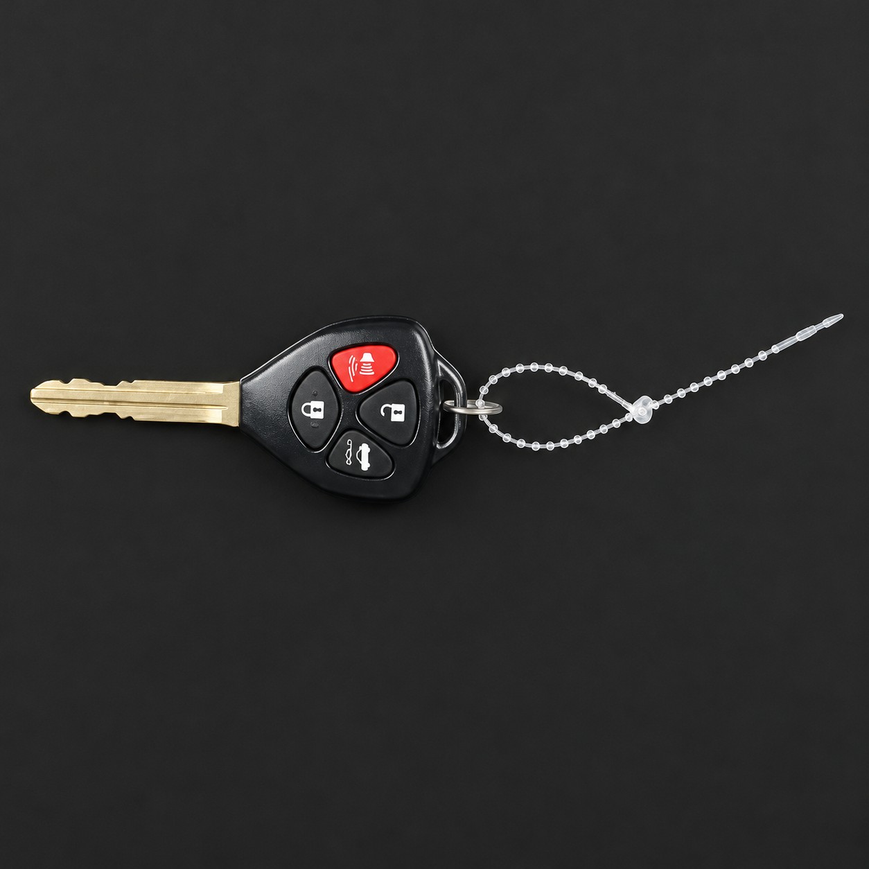 Clear nylon key snaps showing the straight stem and self-locking loop attachment