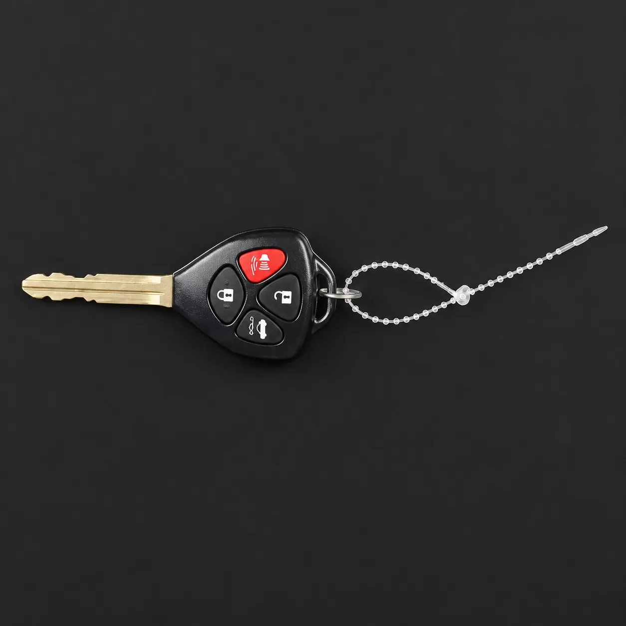 Clear nylon key snaps showing the straight stem and self-locking loop attachment